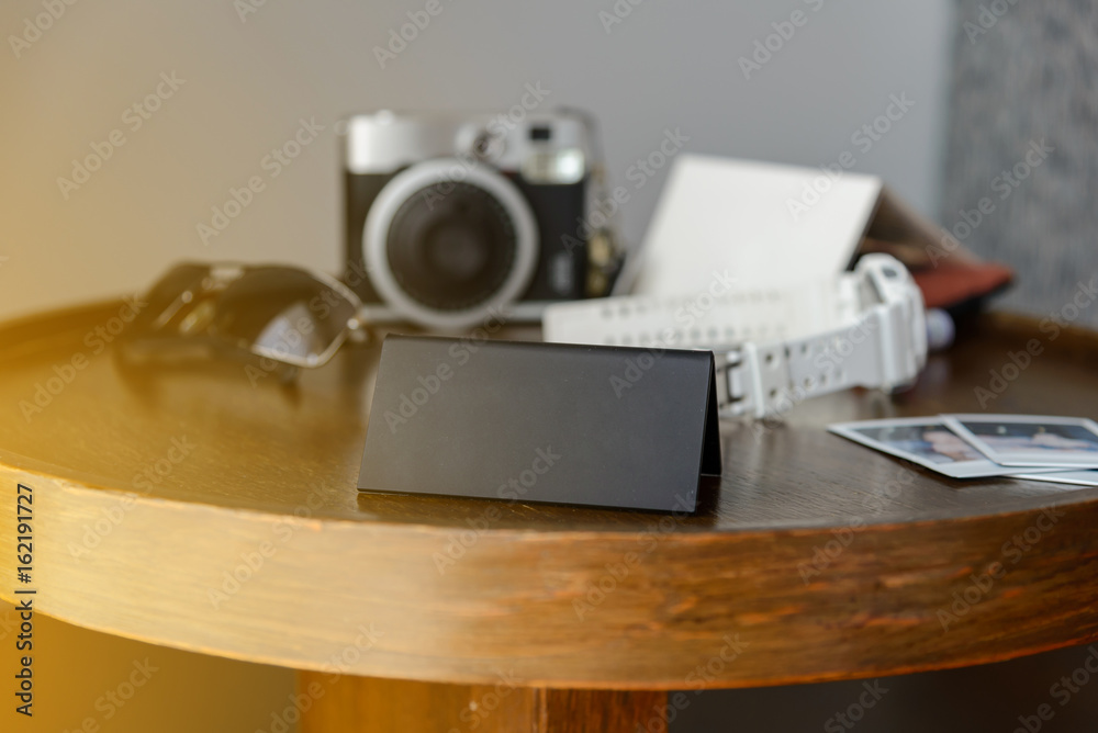 Black plastic triangular sign standing on a table for you text. vacation and travel concept Black plastic triangular sign standing on a table for you text. vacation and travel concept