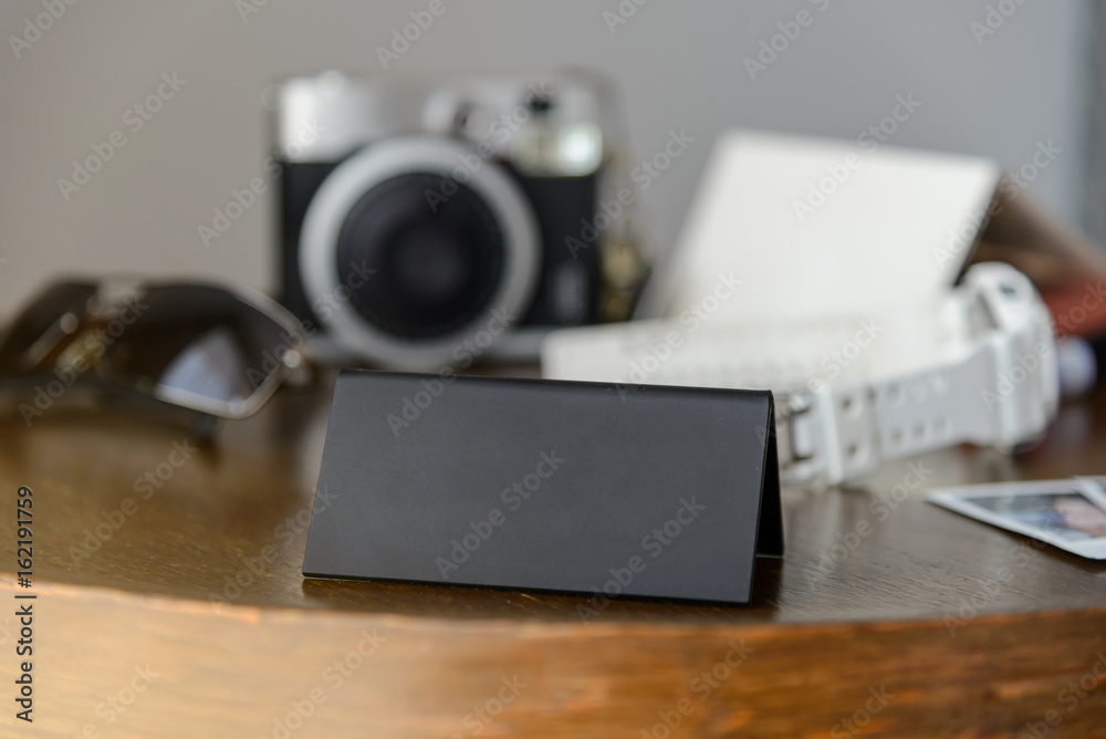 Black plastic triangular sign standing on a table for you text. vacation and travel concept Black plastic triangular sign standing on a table for you text. vacation and travel concept