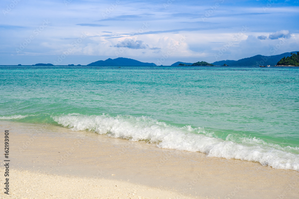 Sea view from tropical beach with sunny sky. Summer paradise beach of lipe island. Tropical shore. Tropical sea in lipe thailand.turquoise Ocean beach relax, outdoor travel.