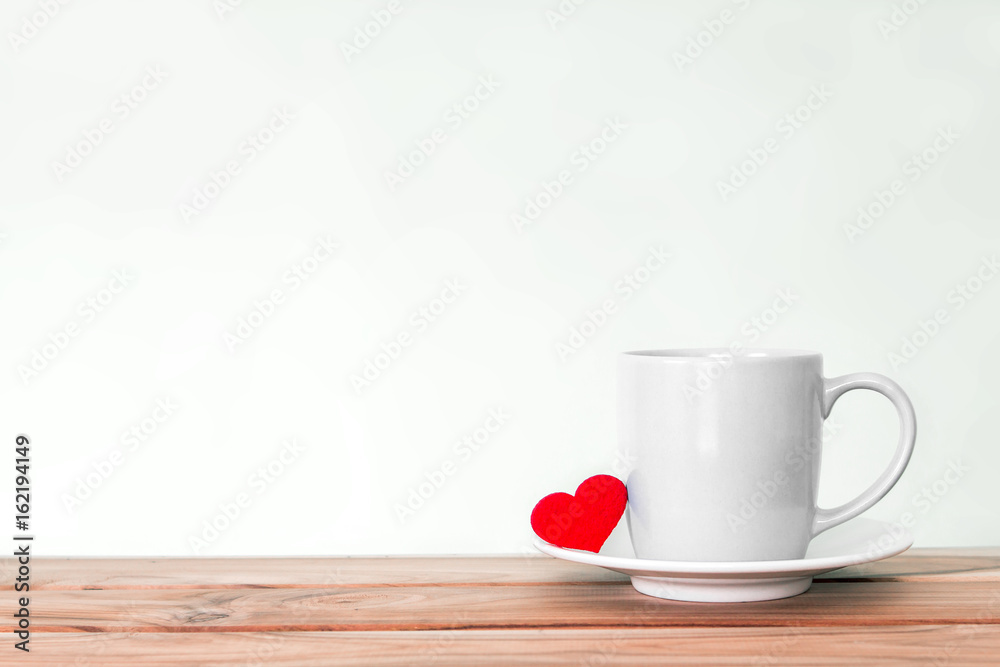 Coffee cup mug with red heart shape on wooden table , Romance and love valentines day background concept Coffee cup mug with red heart shape on wooden table , Romance and love valentines day background concept