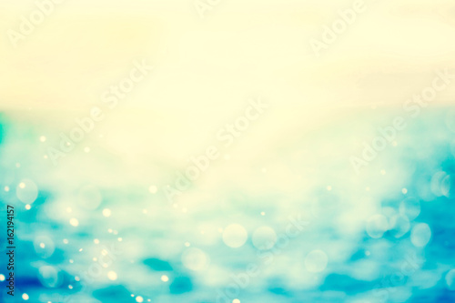 retro color tone of  Blur beautiful shiny sparkling  tropical blue sea beach , the fresh summer background . © Cozine