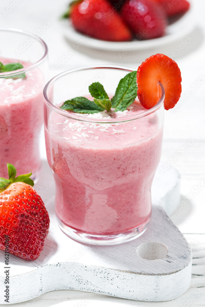 refreshing strawberry milkshake, vertical closeup refreshing strawberry milkshake, vertical closeup