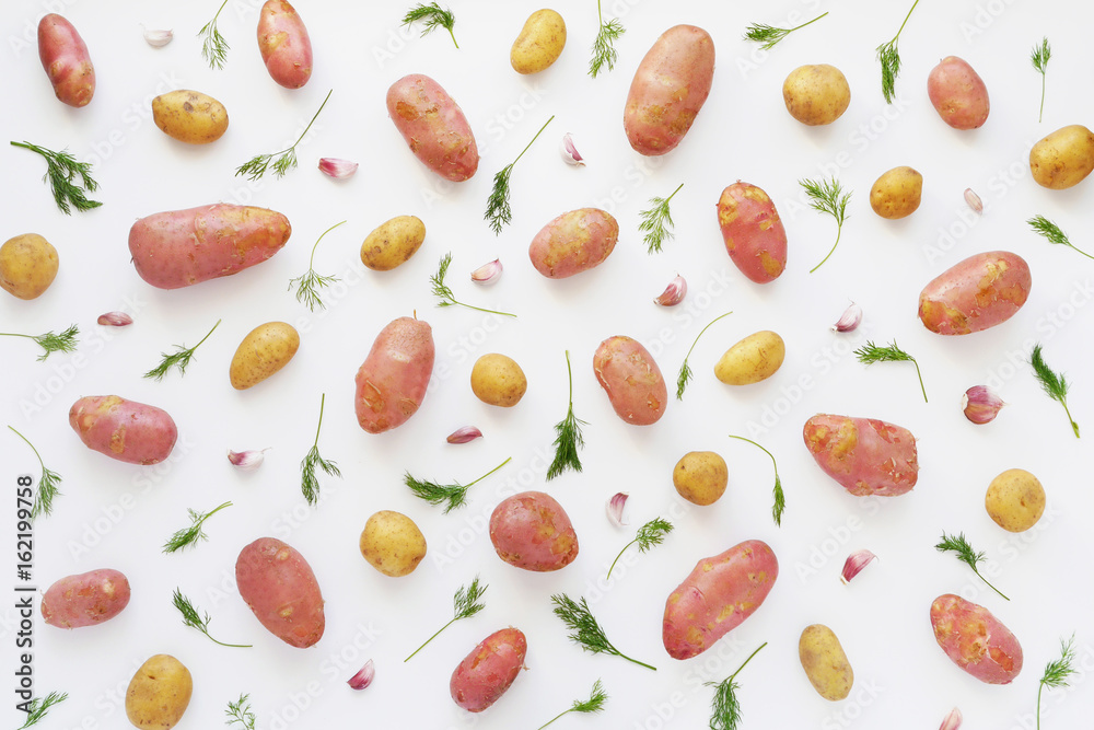 Young potatoes on a white background. Pattern of vegetables. Top view. Pattern of potatoes. Young potatoes on a white background. Pattern of vegetables. Top view. Pattern of potatoes.
