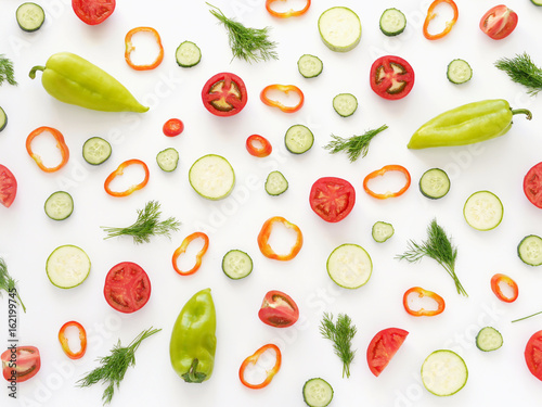 Fototapeta Naklejka Na Ścianę i Meble -  Vegetables on a white background. Pattern of vegetables. Food background. Collage of food. Top view. Composition of  peppers, cucumbers, tomatoes, dill.
