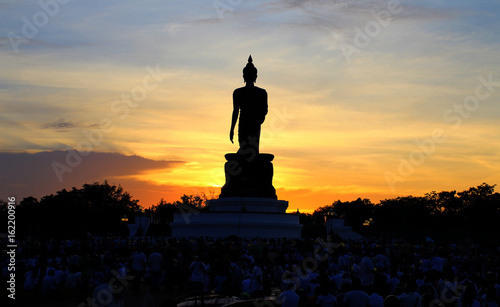 Shadow of big Buddha statue with evening background.