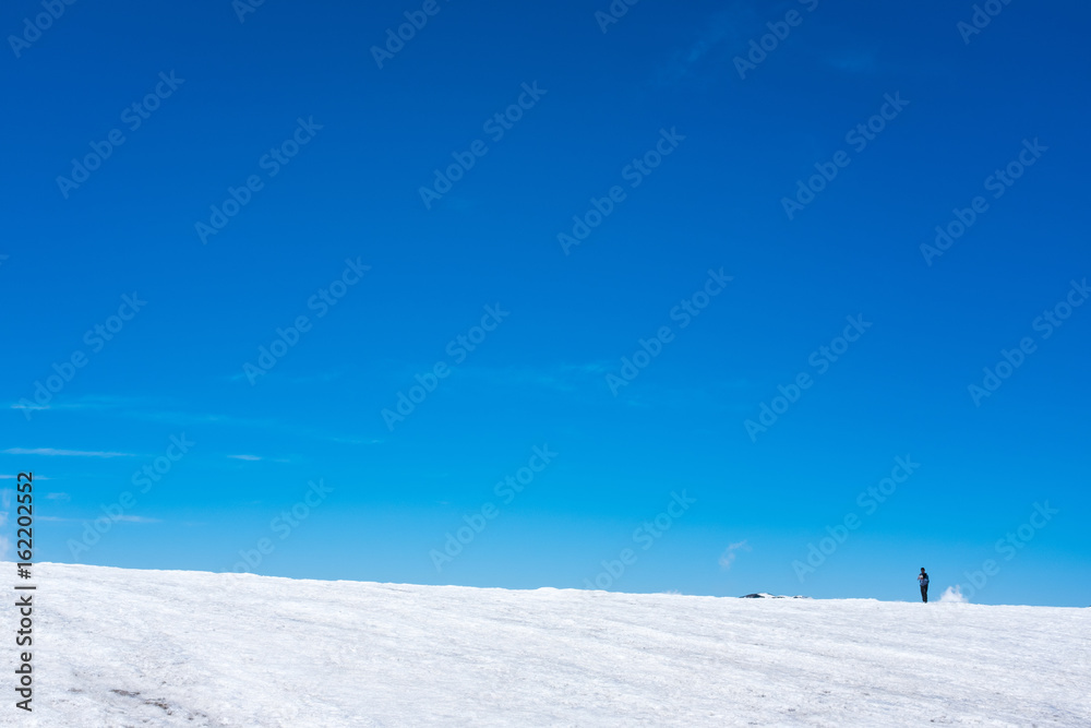 trekking man on snow mountain