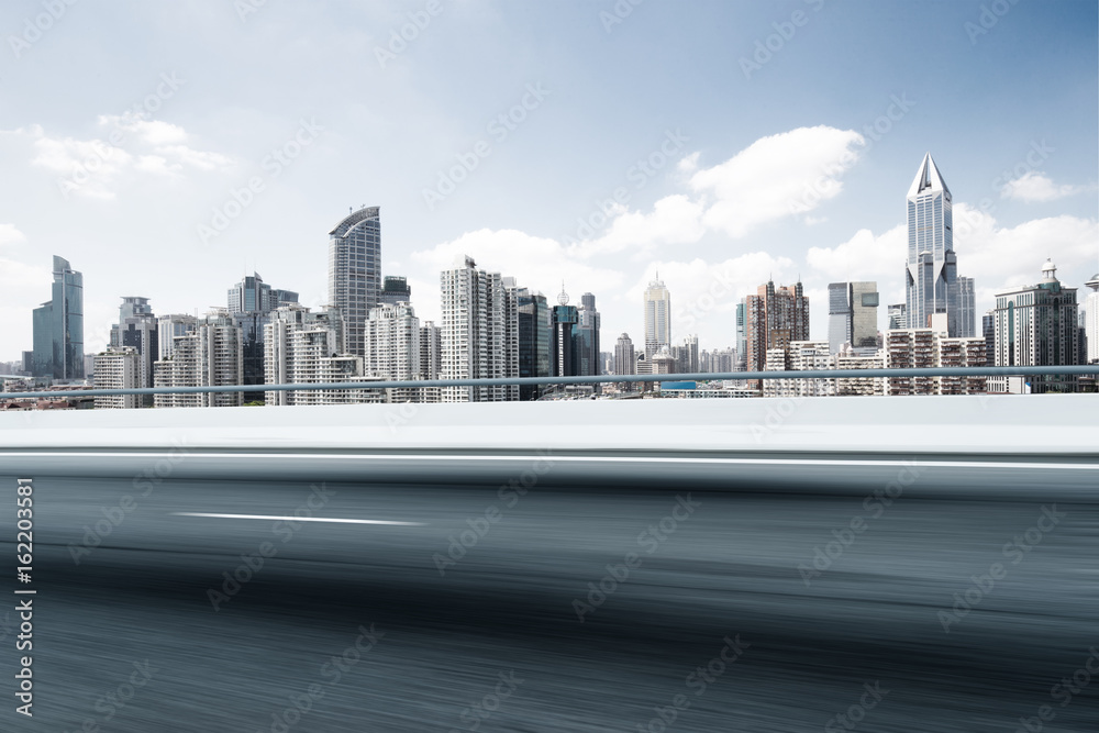 Naklejka premium empty road with modern buildings in modern city