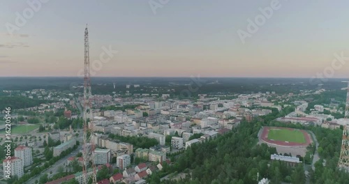 Evening aerial view of ski jumping hills, radio tower, track and field and lake in Lahti, Finland, point of intrest