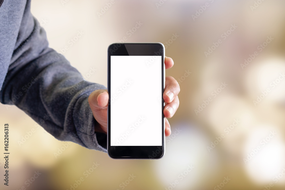 Man using smartphone on blur background.