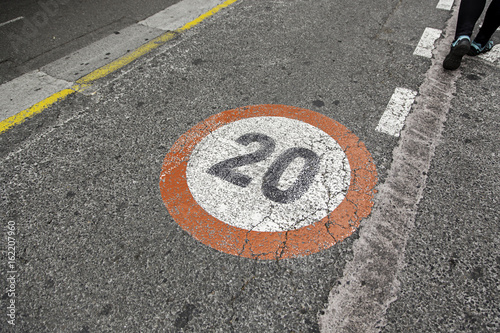 Speed limit sign on asphalt © esebene