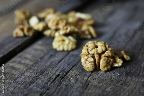 peeled walnut on a wooden background
