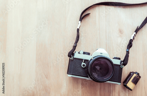 Vintage camera on wooden background