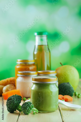 Natural broccoli baby food on the wooden background