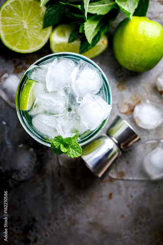 Mojito Cocktail.Mint, lime, ice ingredients for making and bar utensils.Cold Drink.Top View.Copy space for Text.selective focus.