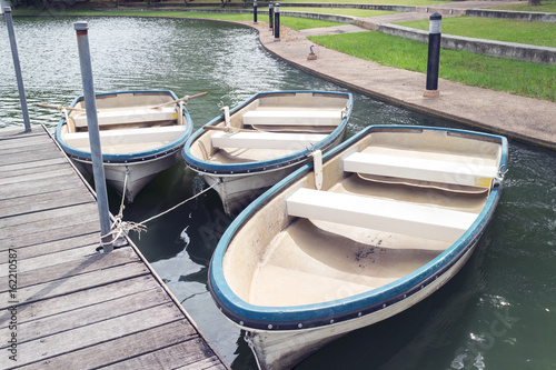 rental row boats in park, filter effect © happycreator