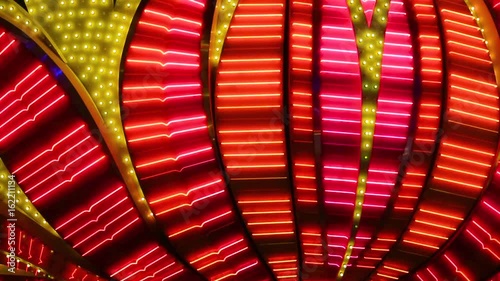 Neon flashing lights of Las Vegas Casino. Flashing neon light on the famous Las Vegas Strip. Las Vegas Neon Lights close-up. Bright night entertainment and advertisement at resort hotel and casino.