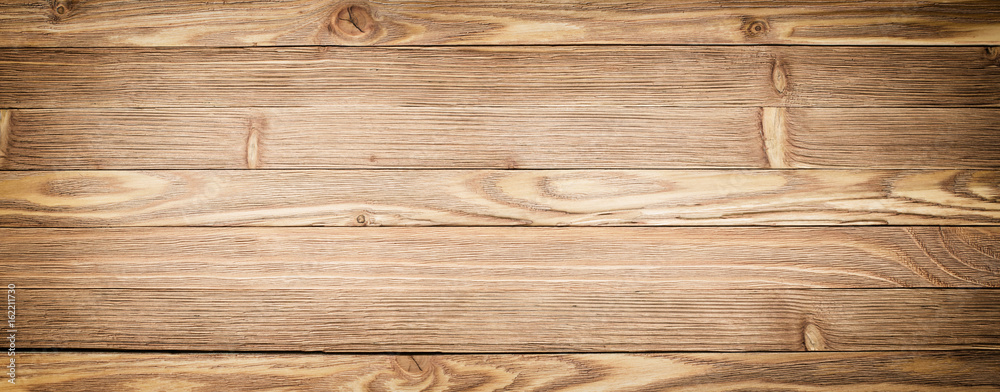 Naklejka premium Panorama wooden background. Light wood texture close-up. Plank table or floor