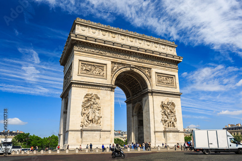 Arc de Triomphe on blue sky background in Paris. © amnach