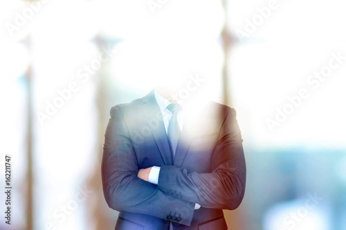 Anonymous businessman crossing his arms