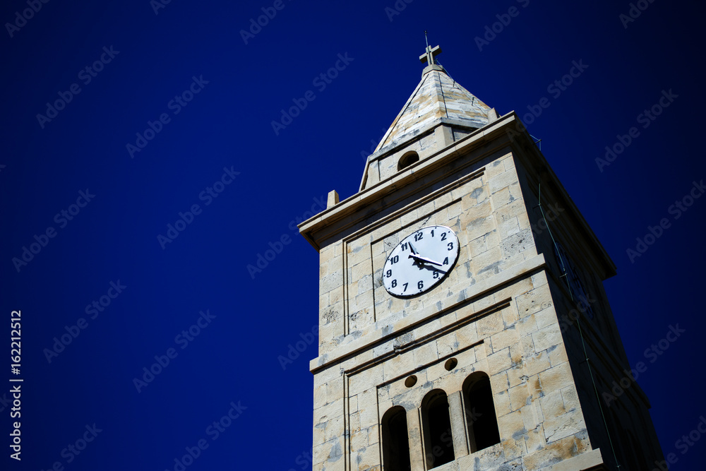 Church tower in Primosten, Croatia Church tower in Primosten, Croatia
