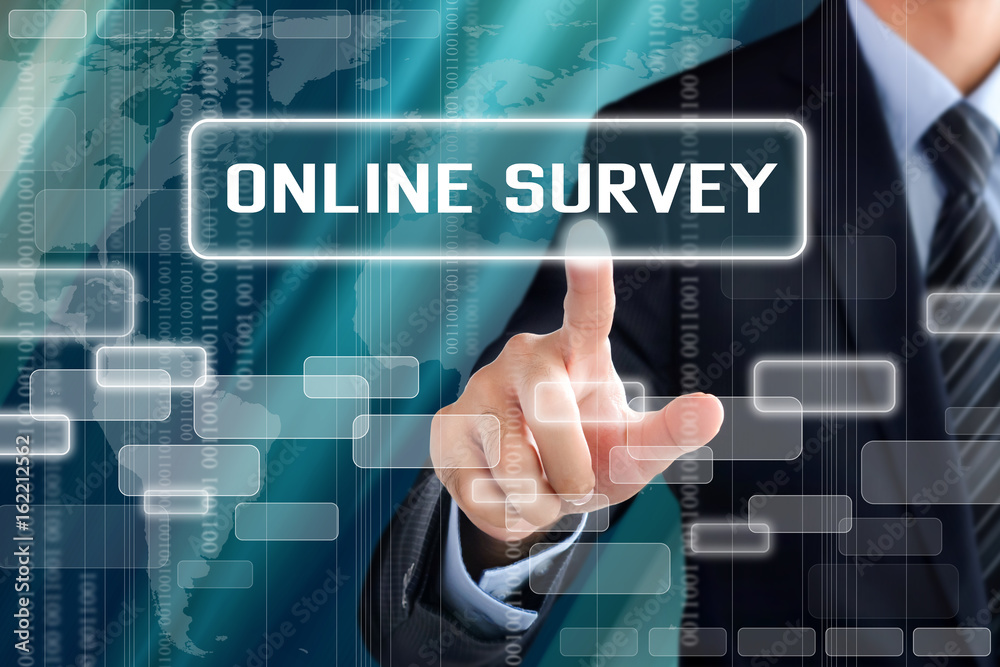 Businessman hand touching ONLINE SURVEY button on virtual screen Businessman hand touching ONLINE SURVEY button on virtual screen