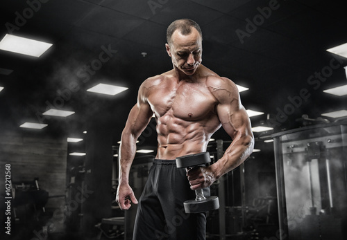 Brutal bodybuilder athletic man with six pack, perfect abs, shoulders, biceps, triceps and chest    Brutal bodybuilder athletic man with six pack, perfect abs, shoulders, biceps, triceps and chest © romanolebedev