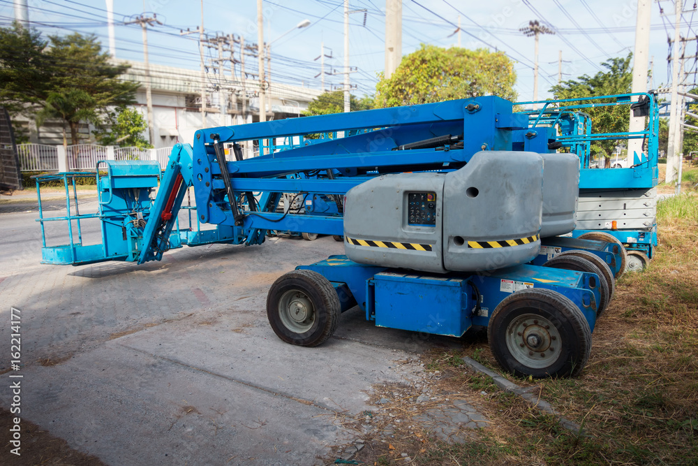 Lifting boom lift in construction site. Lifting boom lift in construction site.