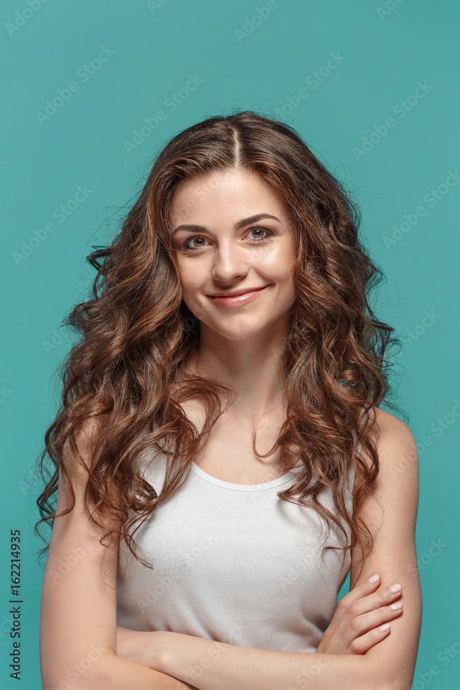 The young woman's portrait with happy emotions The young woman's portrait with happy emotions