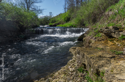 Small double waterfal on a stream. Showing water motion