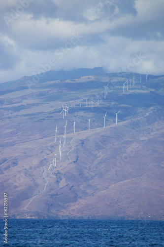 Windmills on the Hawaiian island of Maui generating clean energy photo