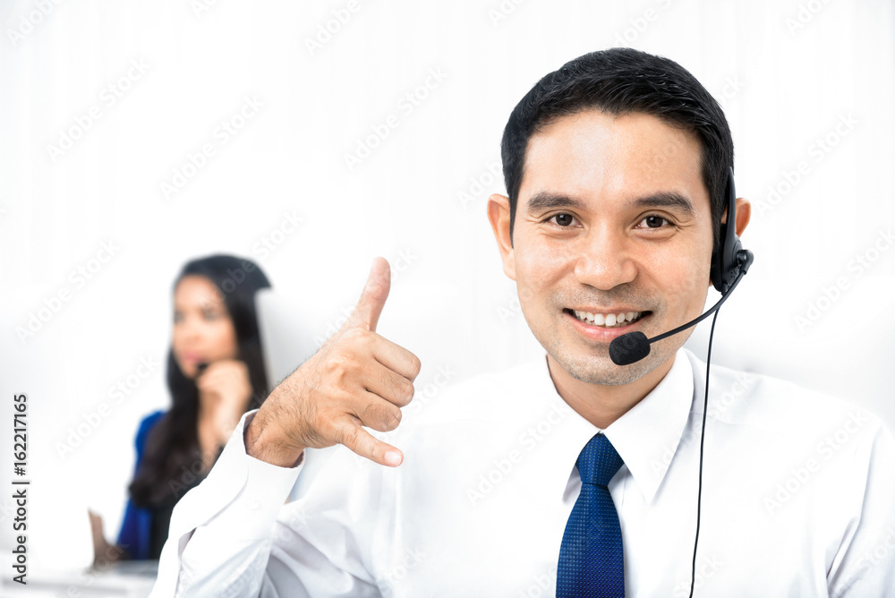 Call center staff making call me gesture Call center staff making call me gesture