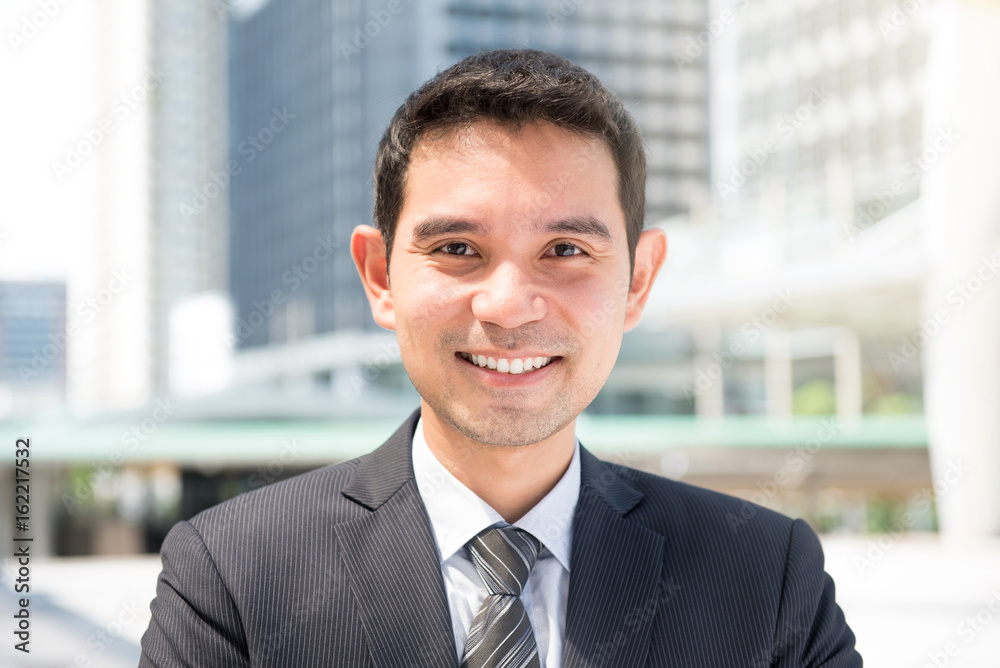 Smiling friendly Asian businessman Smiling friendly Asian businessman