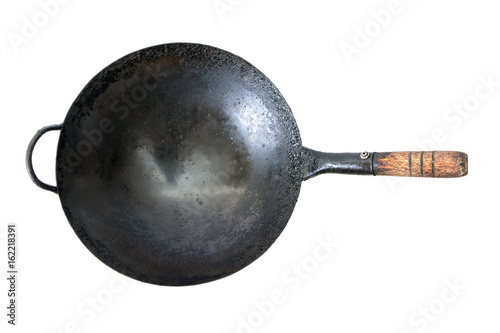 Old dirty frying-pan on white background