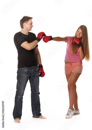 Young people in fighting gloves