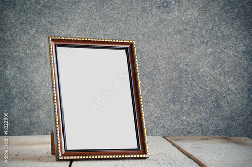 Frame on wooden table.