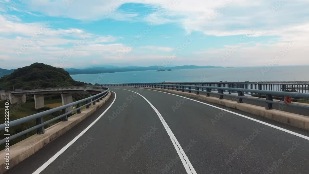 Driving shot of empty, straight road over ocean “Tsunoshima bridge”
Driving shot of empty, straight road over ocean “Tsunoshima bridge”