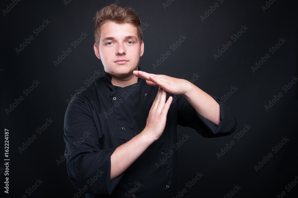 Cook man showing time out hand gesture