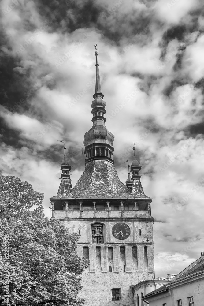 Black and white vertical view of the famous Clock Tower Of The Citadel In Sighisoara, Romania