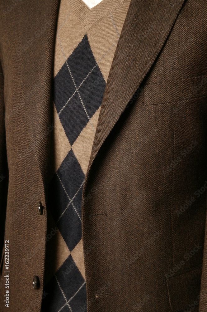 close up of man in a suit with tie and handkerchief