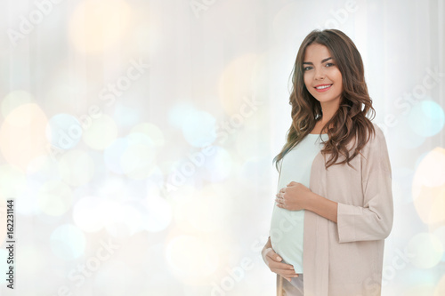 Beautiful pregnant woman st...