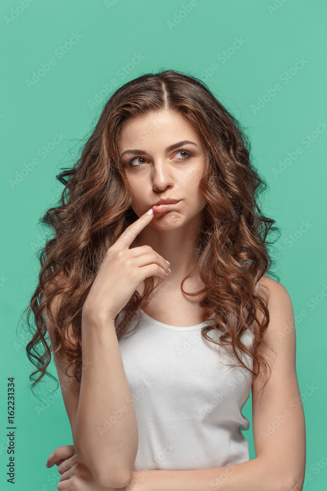 The young woman's portrait with thoughtful emotions The young woman's portrait with thoughtful emotions