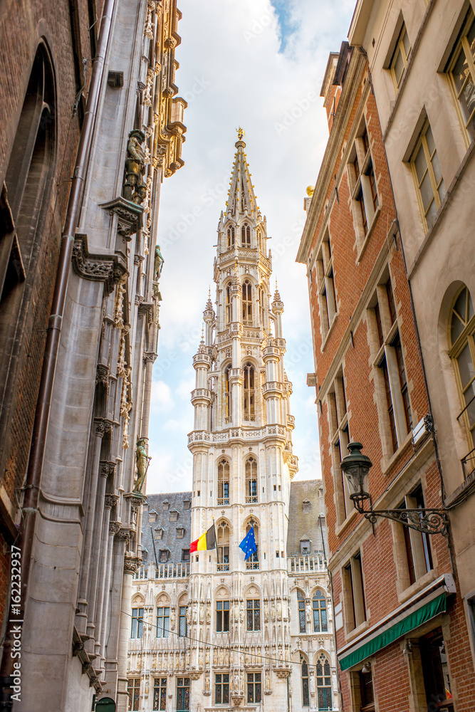 Street view on the cit hall tower on the Grand place central square in the old town of Brussels in Belgium