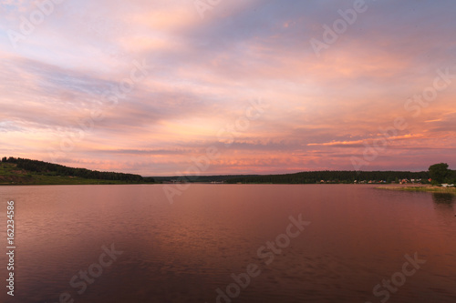 the sky beautiful sunset on the lake © Andrey Cherkasov