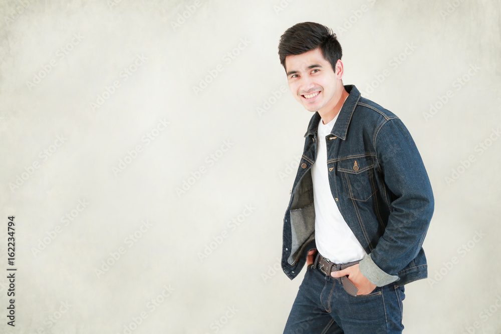 Closeup Asian man casual outfits standing in jeans and black denim shirt,  men black hair and short hair, smiling and wearing jeans jacket, beauty and  fashion concept, and Jeans concept Stock Photo