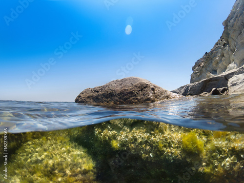 Half under water shot, in the cove infront one stone. photo