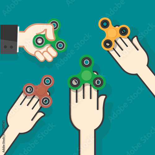 Hands holding popular fidget spinner toy