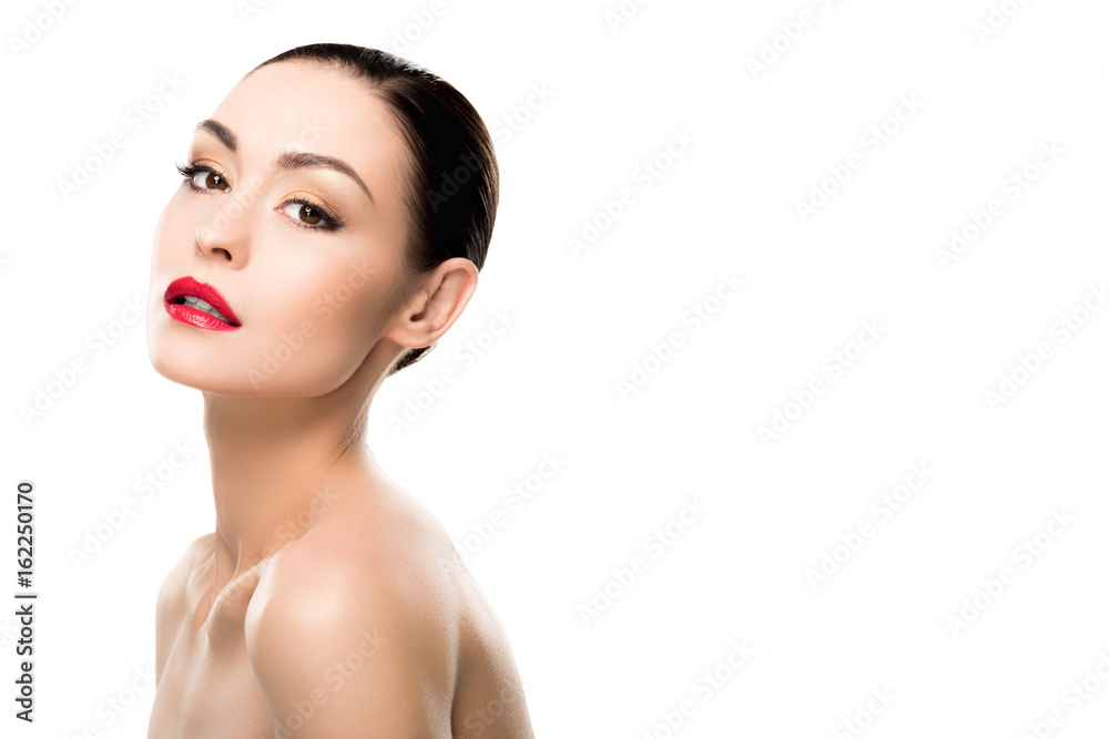 Beautiful naked woman with fashionable makeup looking at camera isolated on white