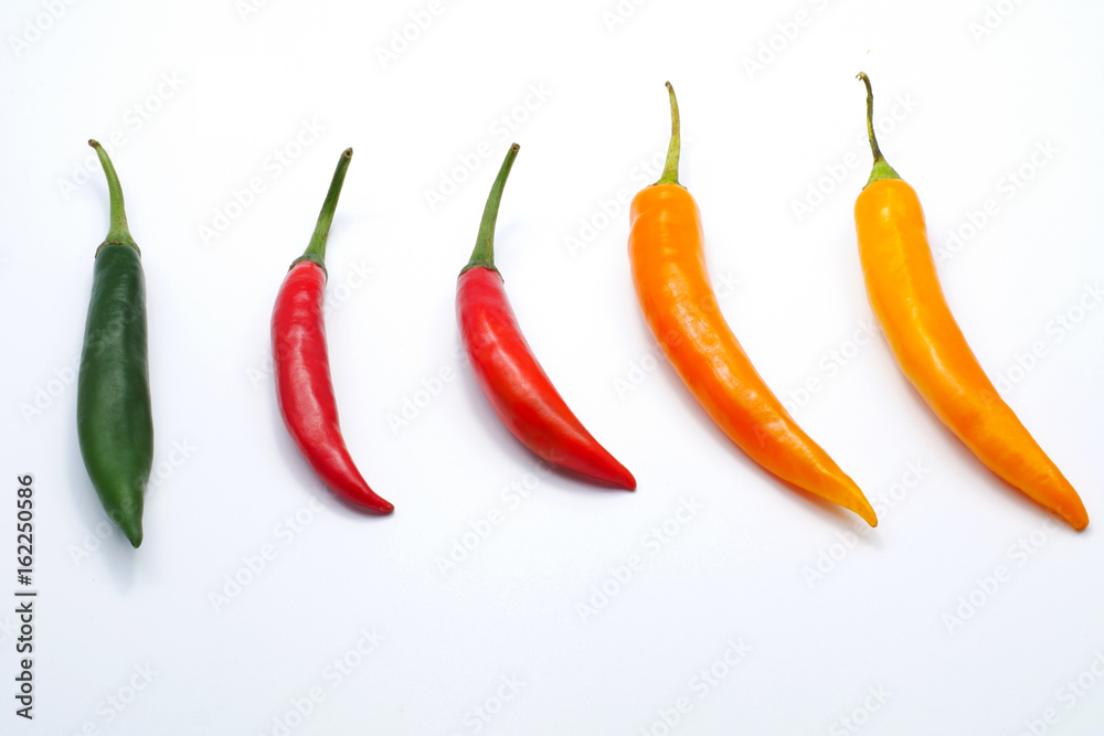 Red green yellow color chilli pepper isolated on white background Red green yellow color chilli pepper isolated on white background