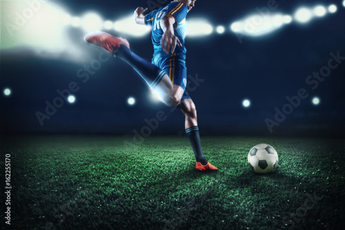 The active player of football at stadium in motion
