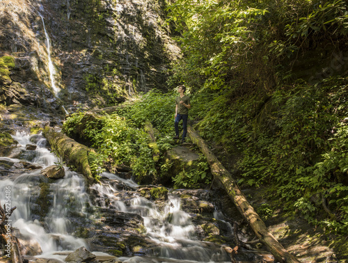 Man hiking at Mingo Falls in the Great Smoky Mountains © Wollwerth Imagery